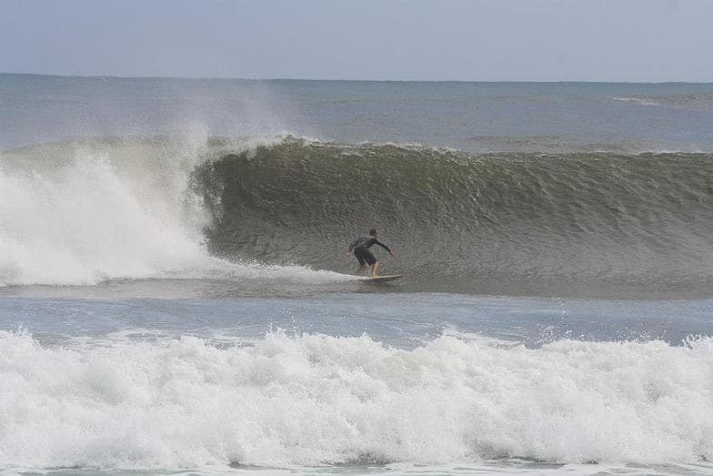 Surfing at Honolii Beach Park, Big Island (Hilo), USA