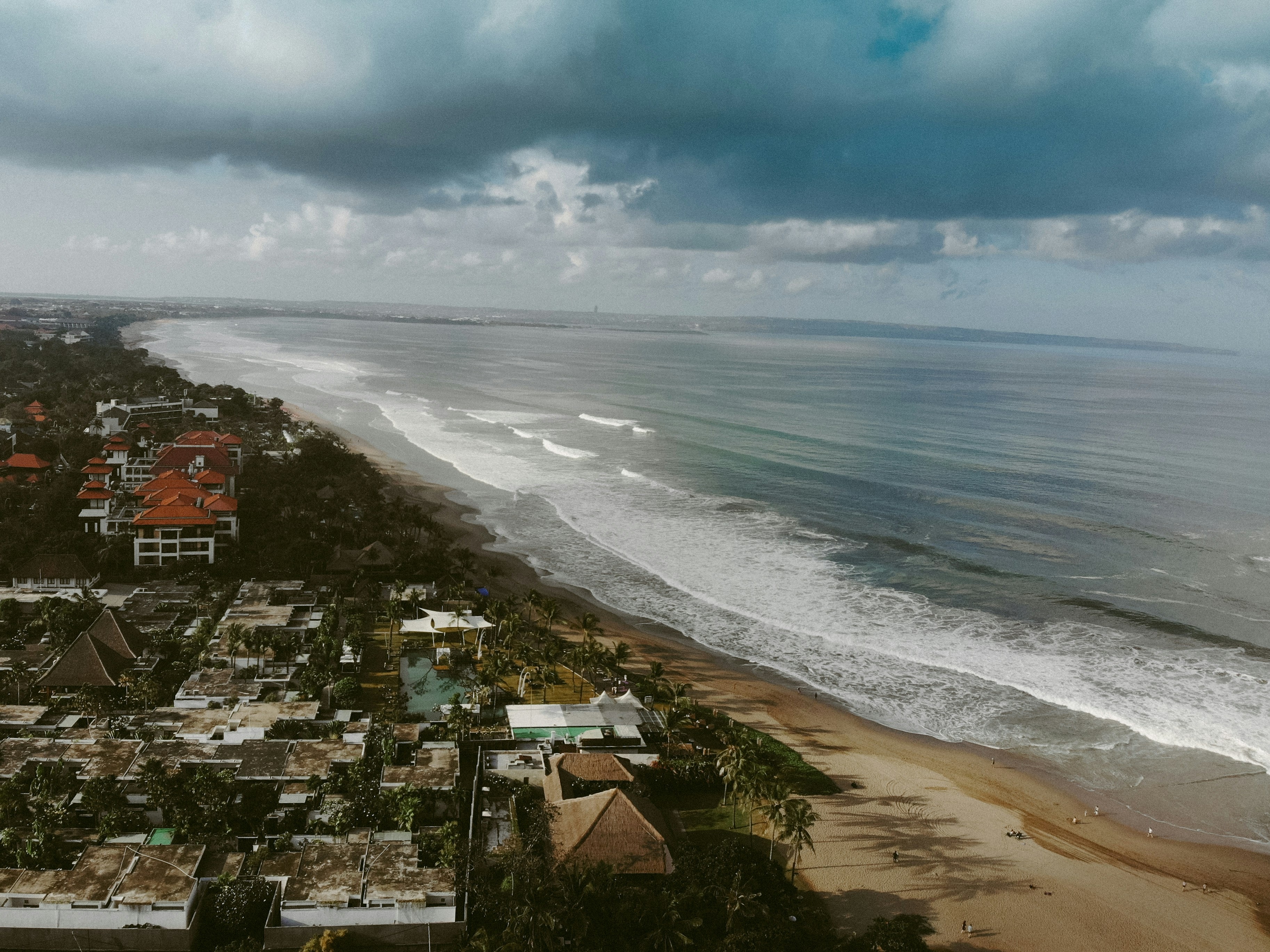 Surfing at Seminyak Beach, Bali, Indonesia