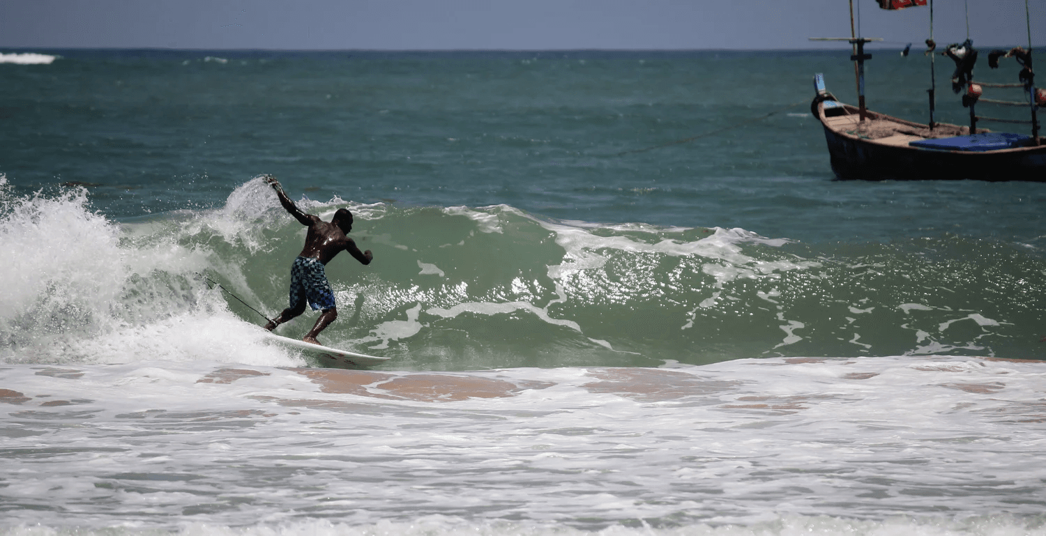 Surfing at Busua Beach, Ahanta West, Ghana