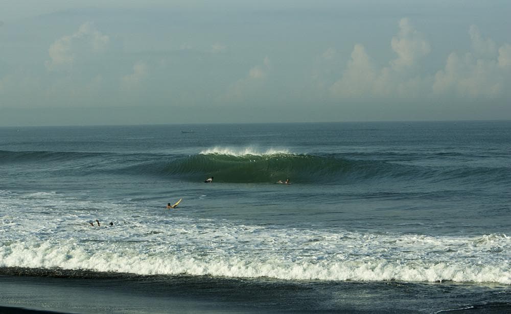 Surfing at Canggu (Echo Beach), Bali, Indonesia