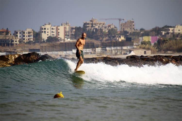 Surfing at Jiyeh Beach, Jiyeh, Lebanon