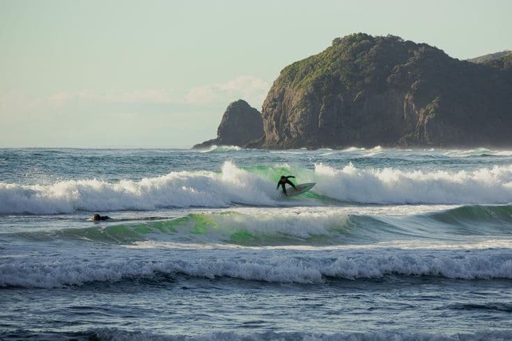 Surfing at Piha, Auckland, New Zealand