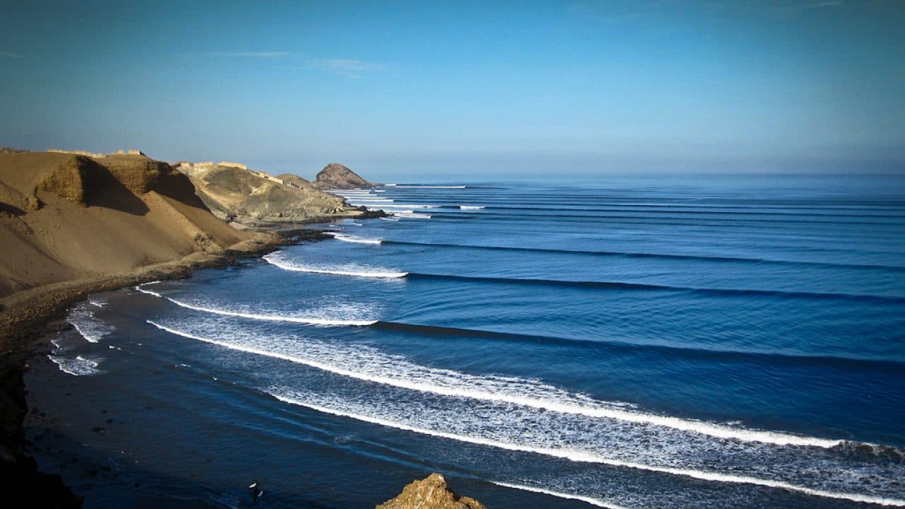 Surfing at Chicama, La Libertad, Peru