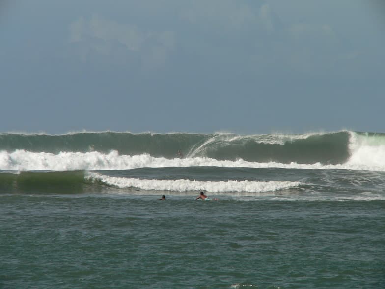 Surfing at Hanalei Bay, Kauai, USA