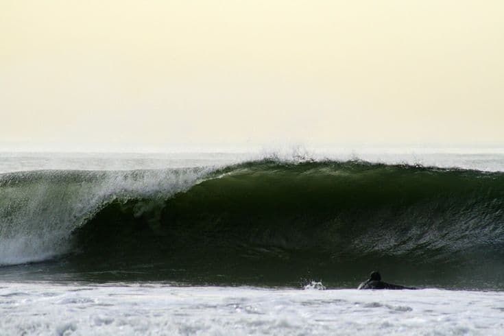 Surfing at Rockaway Beach, New York, USA